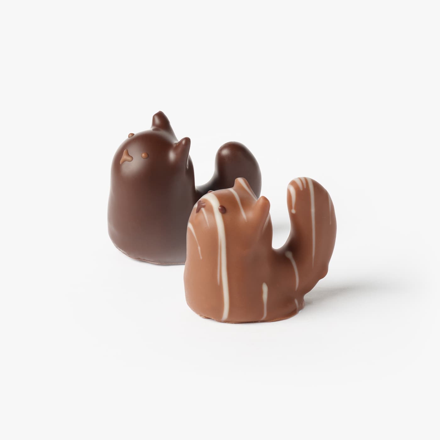 Our Chocolate Black and Tabby Cats are hand-piped with dark chocolate ganache blended with cherries, ready for you to enjoy and indulge to celebrate Halloween.